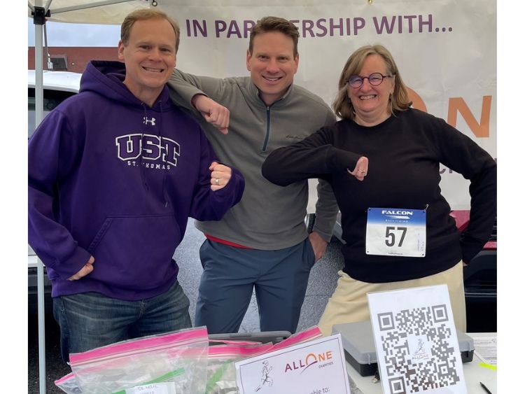 Three AllOne Charities smiling faces