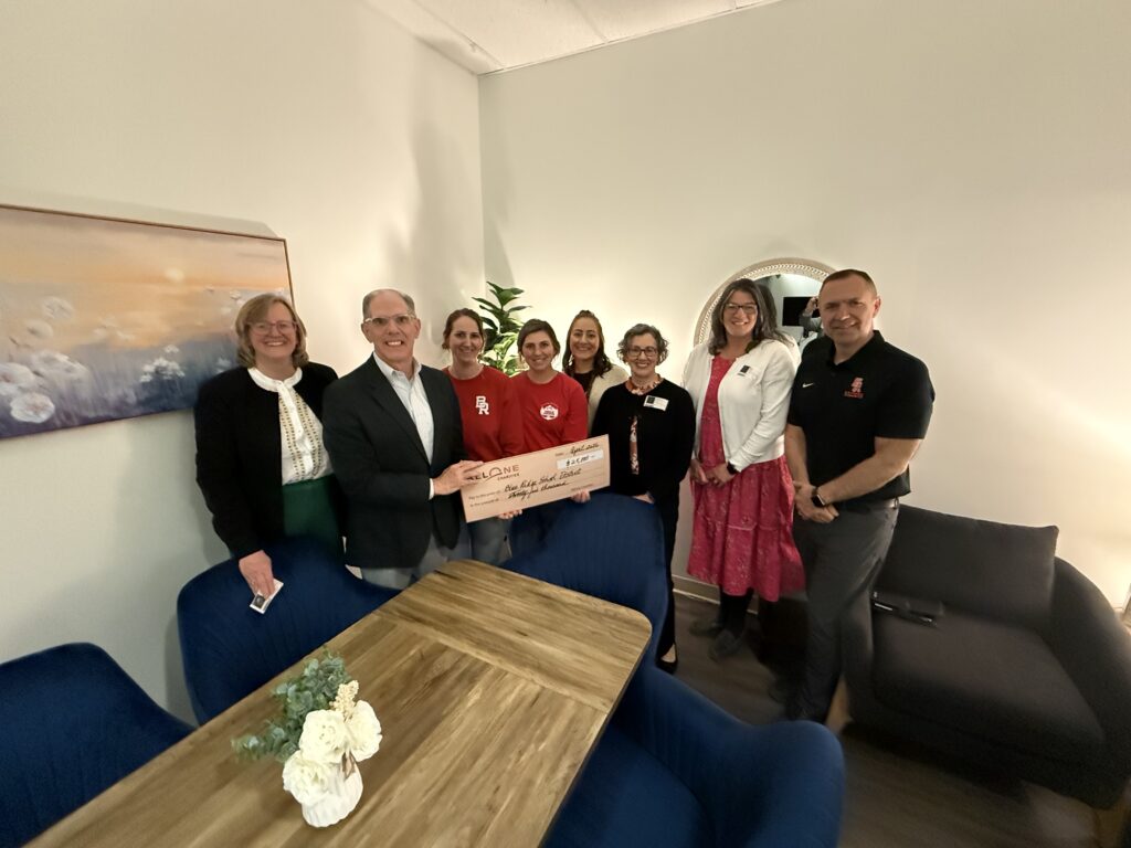 Group stands with $25,000 check for Blue Ridge School District