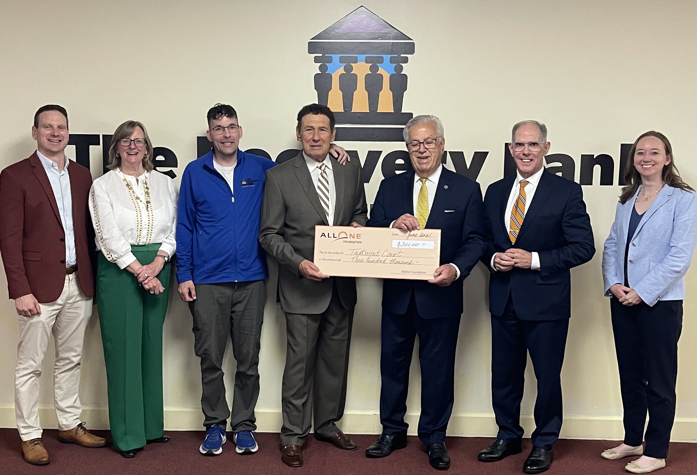 $300.000 check to TCAC with group